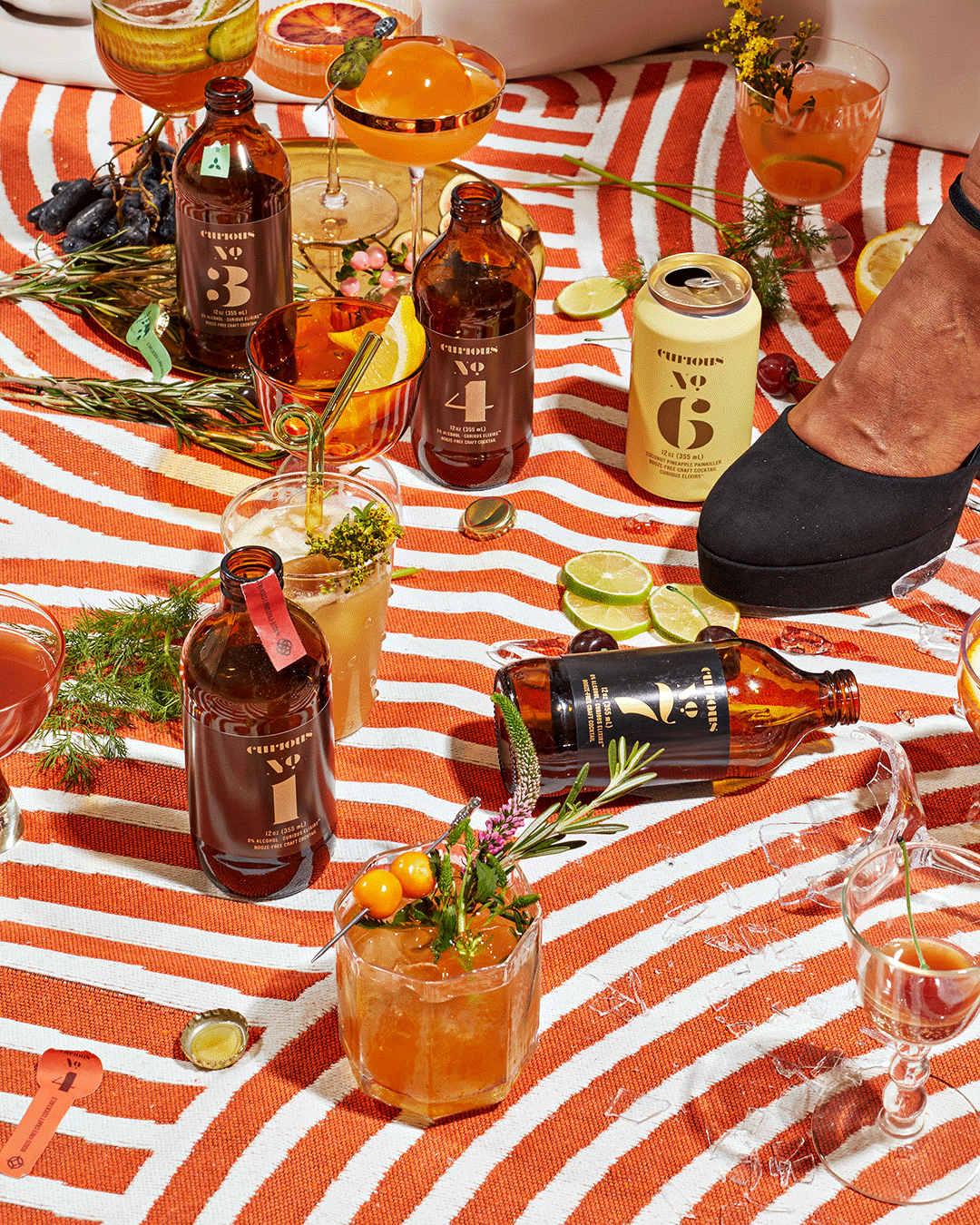 Photo of curious elixirs bottles and cans in a picnic setting