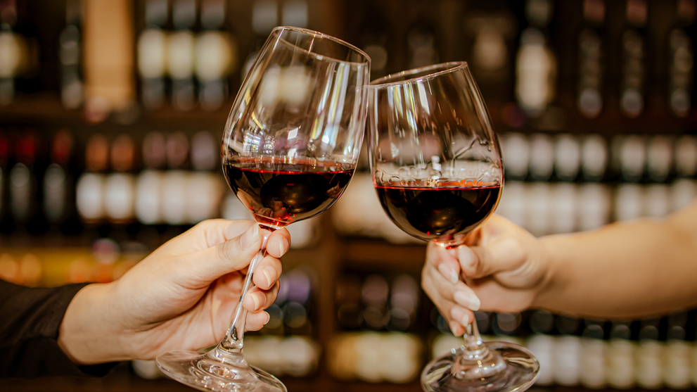 Clinking glasses of wine-inspired adaptogen drinks