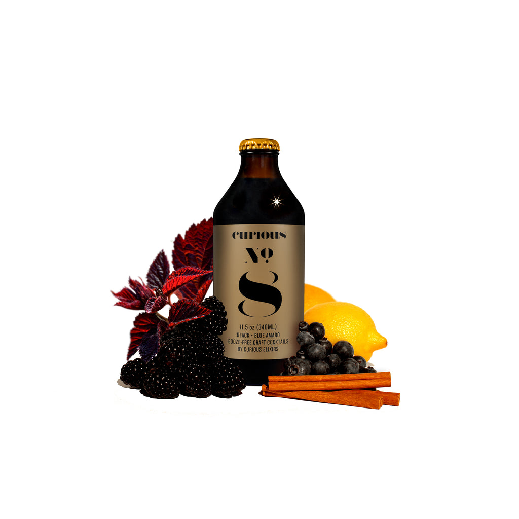 A bottle of Curious No. 8 Booze-Free Digestif with a label featuring the number 8, surrounded by fruits and spices.