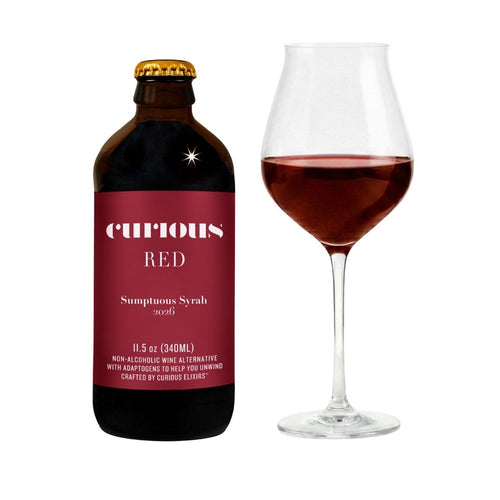 Curious Red nonalcoholic wine alongside wine Glass filled with burgundy liquid