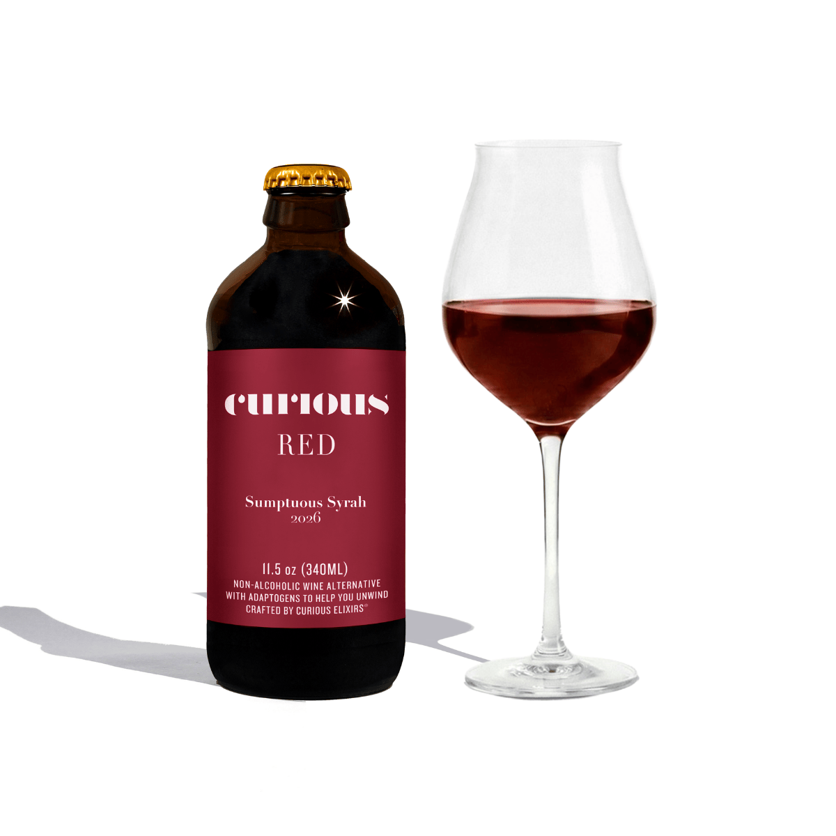 Bottle and glass of  Curious RED Sumptuous Syrah on a white background